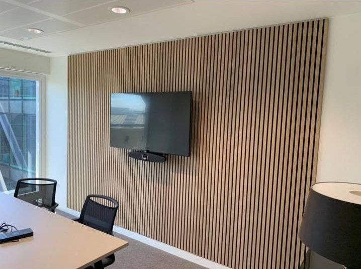 Office fit out in 80 Cannon Street, London_cladding feature wall and installation of audio equipment_Holton Building Services
