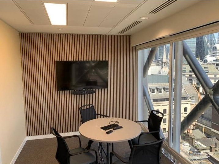 Office fit out in 80 Cannon Street, London_cladding feature wall and installation of audio equipment_Holton Building Services
